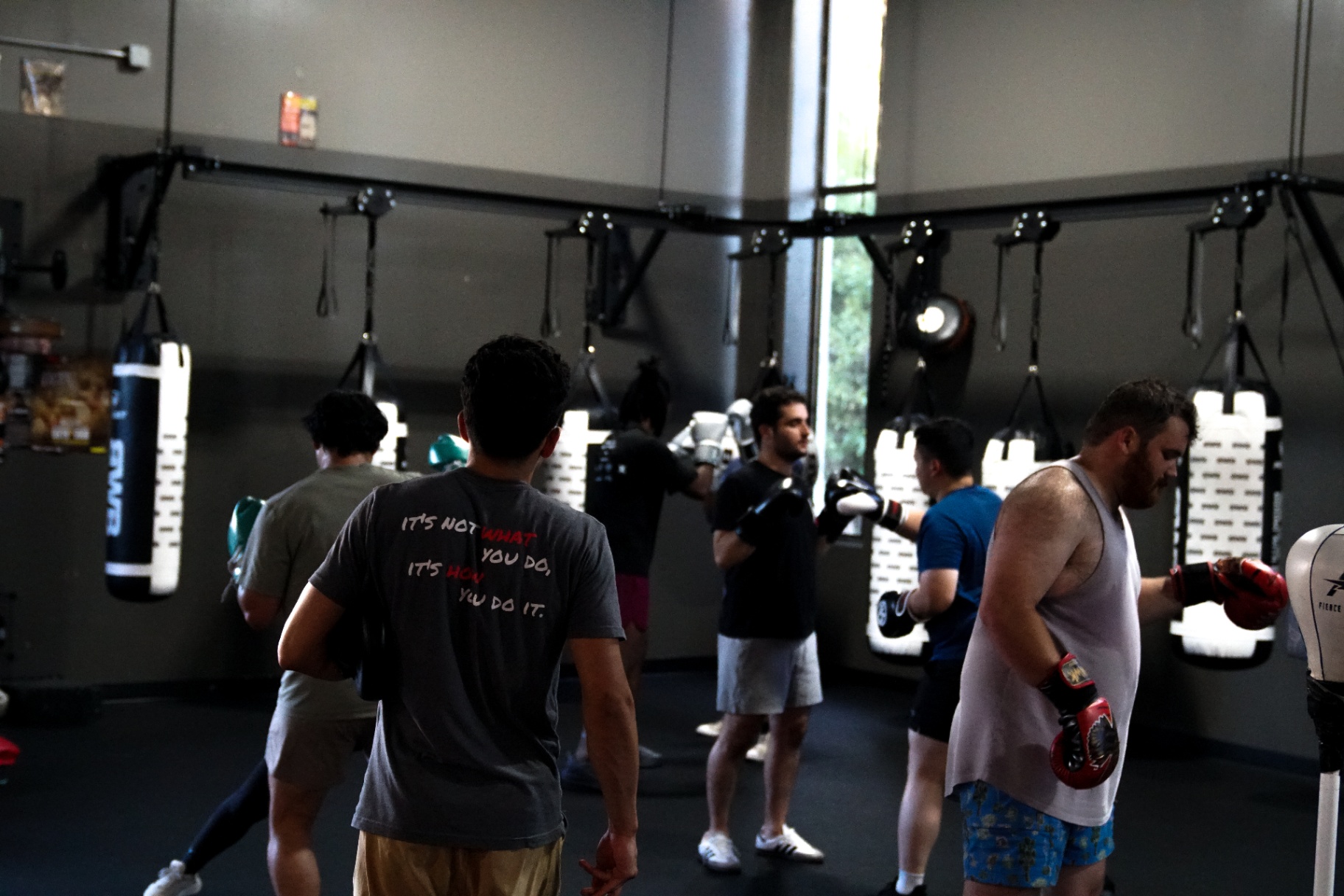 All-levels class working the BWB bag wall together