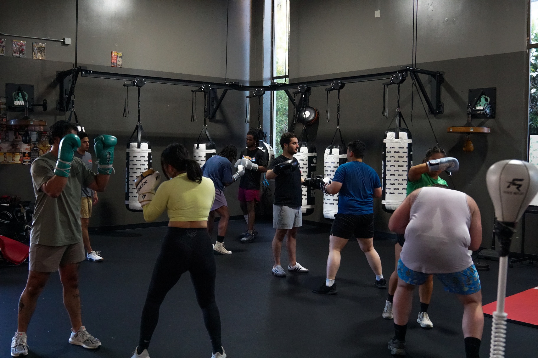 Full class working the BWB heavy-bag wall