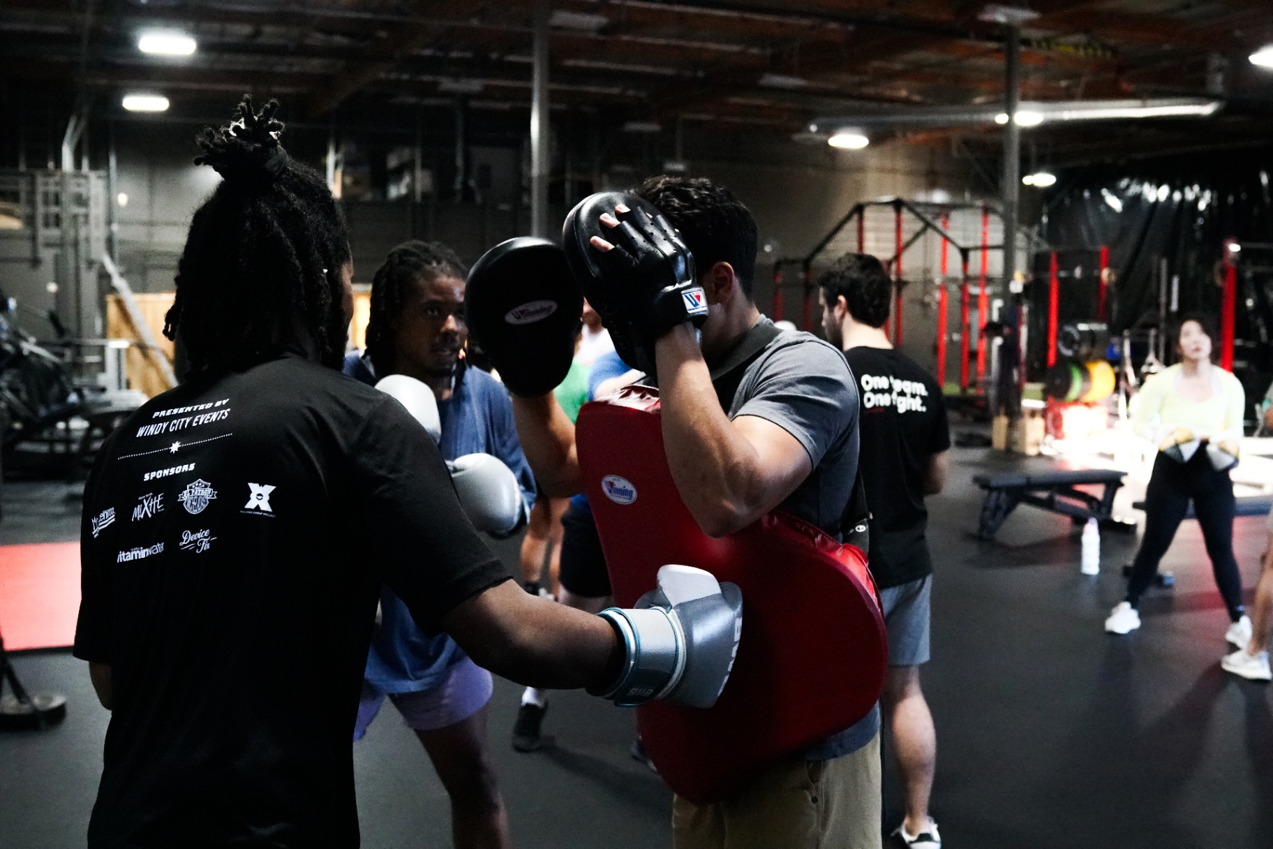 Group mitt work during a partner drill at BWB