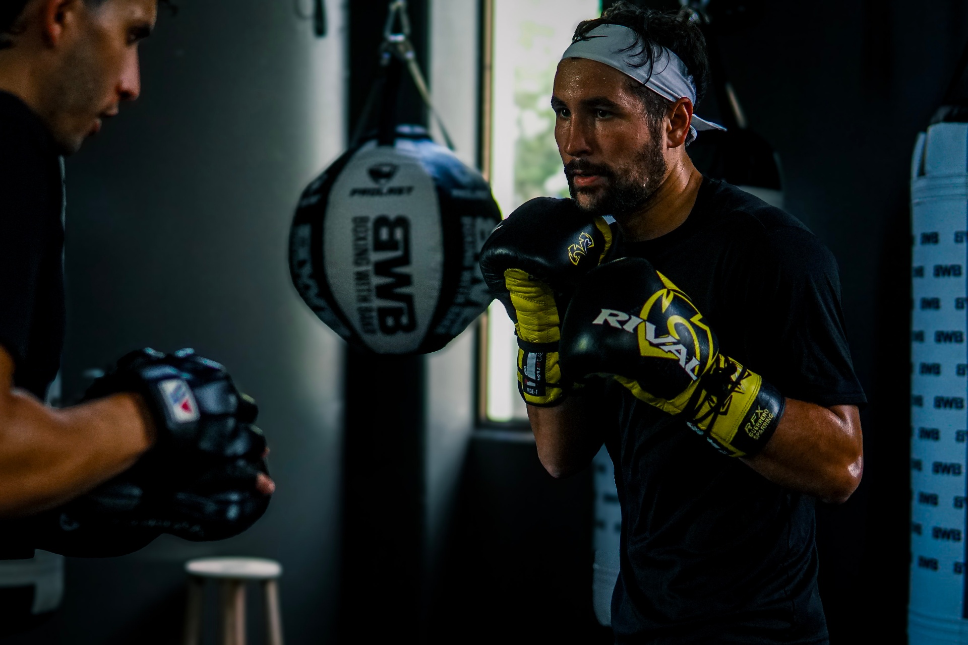 1-on-1 Personal Training — Charlie working mitts one-on-one with a coach at Boxing With Bakr