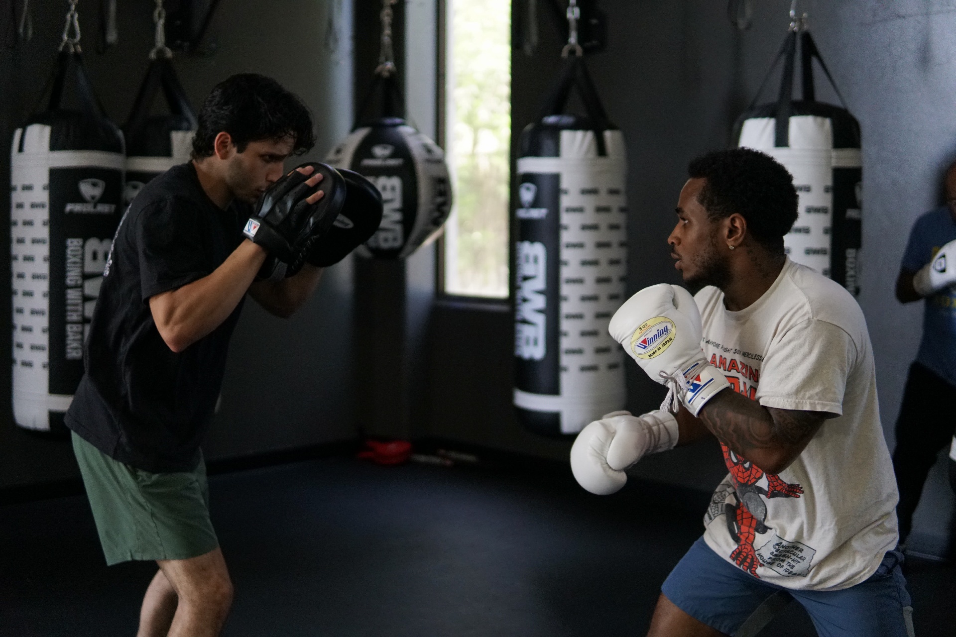 Steve and his coach squared up on the mitts in the BWB bag room